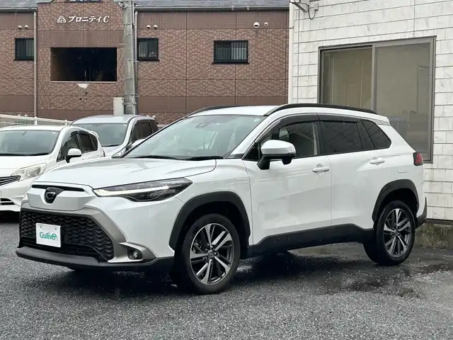 トヨタ カローラ クロス Z 福岡県 2023(令5)年 2.1万km プラチナホワイトパールマイカ ワンオーナー/純正9インチディスプレイオーディオ/　（AM/FM/Bluetooth/フルセグTV）/バックカメラ/トヨタセーフティーセンス/・プリクラッシュセーフティ/・レーントレーシングアシスト/・オートマチックハイビーム/・ロードサインアシスト/・レーダークルーズコントロール/・先行車発進告知機能/オートライト/コナーセンサー/クリアランスソナー/ブラインドスポットモニター/横滑り防止機能/純正18インチアルミホイール/パワーバックドア/ルーフレール/黒色ハーフレザーシート/パワーシート（D席）/シートヒーター（D/N）/ビルトインETC/純正フロアマット/社外ドリンクホルダー/電格ウインカーミラー/USB端子×3/電源ソケット×1/プッシュスタート/ドアバイザー/ISOFIX/盗難防止装置/スペアキー×1/保証書/取扱説明書/ナビ取扱説明書
