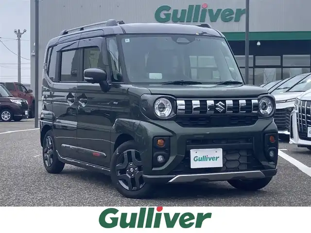 スズキ スペーシア ギア HYBRID XZターボ 島根県 2024(令6)年 0.4万km クールカーキパールメタリック/ガンメタリック2トーン ワンオーナー /メーカーOPナビ(BT/フルセグ/AppleCarPlay)/デュアルセンサーブレーキサポート/車線逸脱抑制/アダクティブクルーズコントロール/先行車発進お知らせ/標識認識/全方位カメラ/両側パワースライドドア /ヘッドアップディスプレイ/ビルトインETC2.0/パドルシフト/前後ドライブレコーダー/前席シートヒーター /ステリングヒーター/ステアリングリモコン/電動格納ミラー/ミラーウィンカー /純正フロアマット/純正ドアバイザー/取扱説明書/保証書/スペアキー×1