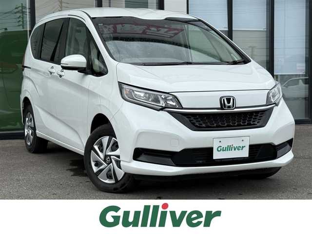 ホンダ フリード ハイブリット G 道南・函館 2024(令6)年 0.9万km プラチナホワイトパール 純正メモリナビ/・フルセグＴＶ/・寒冷地仕様/・衝突被害軽減ブレーキ/・バックカメラ/・レーダークルーズコントロール/・車線逸脱警報/・両側パワースライドドア/・前後ドライブレコーダー/・前席シートヒーター/・LEDアダプティブコーナリングライト/・ウォークスルー/・ETC/・新車時保証書・取扱説明書