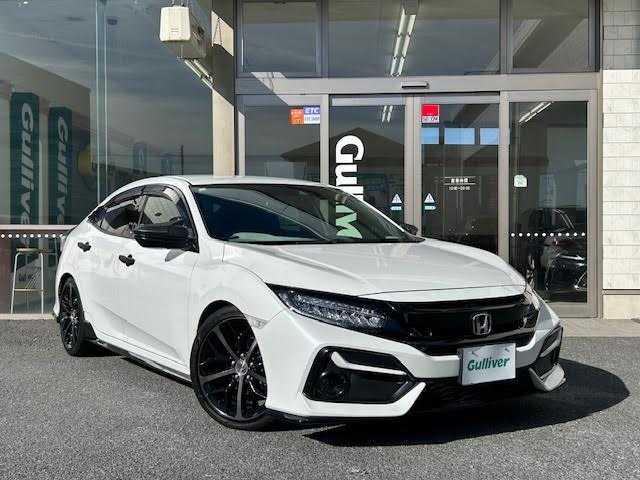 ホンダ シビック ハッチバック 埼玉県 2020(令2)年 8.7万km プラチナホワイトパール Honda SENSING/レーンキープアシスト/レーダークルーズコントロール/純正ナビ/　　Bluetooth/DVD再生機能/CD/フルセグTV/バックカメラ/LEDヘッドライト/純正18インチアルミホイール/ETC/前席パワーシート/シートヒーター/アイドリングストップ/ECON/ブレーキホールド/純正マフラー/社外ウイング/純正ウイング車載あり/無限MUGENフロアマット/SPOON プログレッシブスプリング リア2本/カーボン調ドアミラーカバー/ドアプロテクター