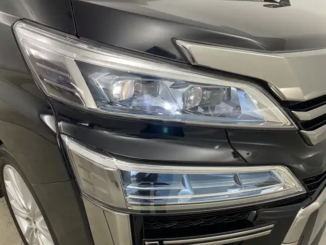 トヨタ ヴェルファイア Z Aエディション 道央・札幌 2018(平30)年 7.3万km ブラック ・純正ナビ&BT&CD&DVD&SD/・両側パワースライドドア/・バックカメラ/・フリップダウンモニター/・トヨタセーフティセンス/・プリクラッシュセーフティ/・レーントレーシングアシスト/・クリアランスソナー/・ロードサインアシスト/・アイドリングストップ/・横滑り防止装置/・nanoe/・ビルトインETC2.0/・オットマン/・ステアリングスイッチ/・電動格納ミラー/・純正フロアマット/・プッシュスタート/・LEDヘッドライト/・オートマチックハイビーム/・オートライト/・スマートキー
