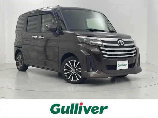トヨタ ルーミー カスタムG－T 茨城県 2022(令4)年 1.8万km プラムブラウンパールクリスタルシャイン 社外9型ナビ/バックカメラ/フルセグ/衝突被害軽減ブレーキ/車線逸脱抑制装置/レーダークルーズコントロール/オートマチックハイビーム/クリアランスソナー/両側電動スライドドア/ETC/ドラレコ/シートヒーター/純正15インチAW/LEDヘッドライト/スマートキー