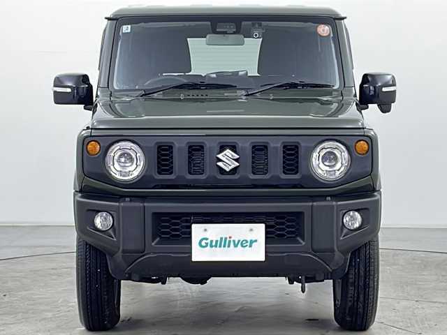 スズキ ジムニー XC 道央・札幌 2025(令7)年 0.2万km ジャングルグリーン ・４WD/・寒冷地仕様/・社外SDナビ/（CD DVD SD BT フルセグ）/・衝突軽減/・レーンキープアシスト/・クルーズコントロール/・ステアリングスイッチ/・D/Nシートヒーター/・ドアミラーヒーター/・LKA/・ダウンヒルアシスト/・LEDヘッドライト/・フォグランプ/・バックカメラ/・社外ドラレコ（前）/・純正１６インチAW