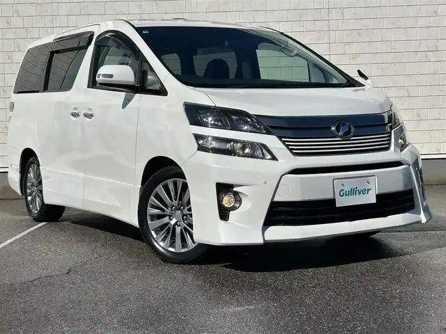 トヨタ ヴェルファイア 2．4Z ゴールデンアイズⅡ 富山県 2014(平26)年 8.7万km ホワイトパールクリスタルシャイン 純正ナビ/Bluetooth/CD/DVD/ツインムーンルーフ/両側パワースライドドア/パワーバックドア/バックカメラ/クルーズコントロール/HIDヘッドライト/コーナーセンサー/ドライブレコーダー/スマートキー/ETC/純正フロアマット/ハーフレザーシート