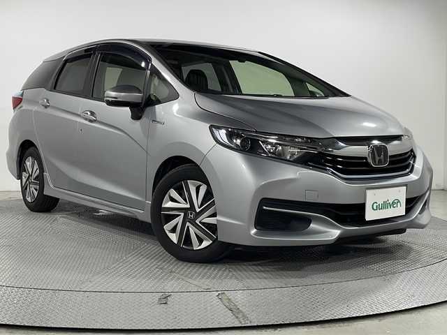 ホンダ シャトル ハイブリッド ホンダセンシング 広島県 2018(平30)年 6.5万km ルナシルバーM 禁煙車/社外7型ナビ/アダプティブクルーズコントロール/バックカメラ/ホンダセンシング/レーンキープ/横滑り防止装置/ドライブレコーダー/ビルトインETC/スマートキー/フロアマット