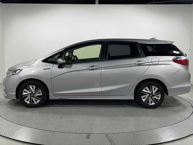 ホンダ シャトル ハイブリッド ホンダセンシング 広島県 2018(平30)年 6.5万km ルナシルバーM 禁煙車/社外7型ナビ/アダプティブクルーズコントロール/バックカメラ/ホンダセンシング/レーンキープ/横滑り防止装置/ドライブレコーダー/ビルトインETC/スマートキー/フロアマット