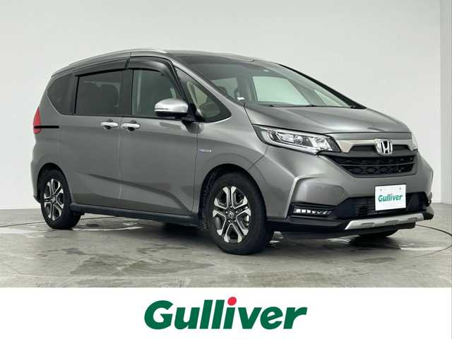 ホンダ フリード ハイブリット クロスター ホンダセンシング 愛知県 2022(令4)年 6.2万km スーパープラチナグレーメタリック ・純正ナビ/・Bluetooth/・バックカメラ/・フルセグTV/・ホンダセンシング/・衝突被害軽減システム/・コーナーセンサー/・レーンキープアシスト/・クルーズコントロール/・オートライト/・LEDヘッドライト/・両側パワースライドドア/・ドライブレコーダー/・シートヒーター/・ETC/・純正AW/・プッシュスタート/・スマートキー