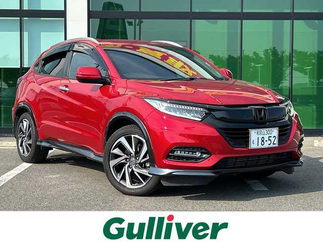 ホンダ ヴェゼル ツーリング・ホンダセンシング 和歌山県 2019(令1)年 5.7万km プレミアムクリスタルレッドM 社外ナビ/フルセグTV/（AM/FM/CD/DVD/Bluetooth/USB）/衝突軽減ブレーキ/レーンキープ/横滑り防止/クルーズコントロール/パドルシフト/ETC/ドライブレコーダー/オートライト/フォグランプ/スマートキー/プッシュスタート/ハンドルスイッチ/純正フロアマット/純正AW/革巻ハンドル/社外マフラー