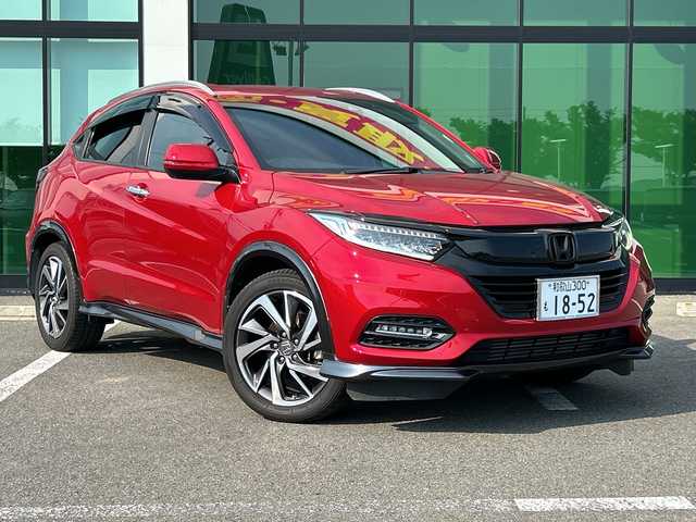ホンダ ヴェゼル ツーリング・ホンダセンシング 和歌山県 2019(令1)年 5.7万km プレミアムクリスタルレッドM 社外ナビ/フルセグTV/（AM/FM/CD/DVD/Bluetooth/USB）/衝突軽減ブレーキ/レーンキープ/横滑り防止/クルーズコントロール/パドルシフト/ETC/ドライブレコーダー/オートライト/フォグランプ/スマートキー/プッシュスタート/ハンドルスイッチ/純正フロアマット/純正AW/革巻ハンドル/社外マフラー