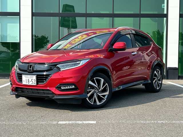 ホンダ ヴェゼル ツーリング・ホンダセンシング 和歌山県 2019(令1)年 5.7万km プレミアムクリスタルレッドM 社外ナビ/フルセグTV/（AM/FM/CD/DVD/Bluetooth/USB）/衝突軽減ブレーキ/レーンキープ/横滑り防止/クルーズコントロール/パドルシフト/ETC/ドライブレコーダー/オートライト/フォグランプ/スマートキー/プッシュスタート/ハンドルスイッチ/純正フロアマット/純正AW/革巻ハンドル/社外マフラー