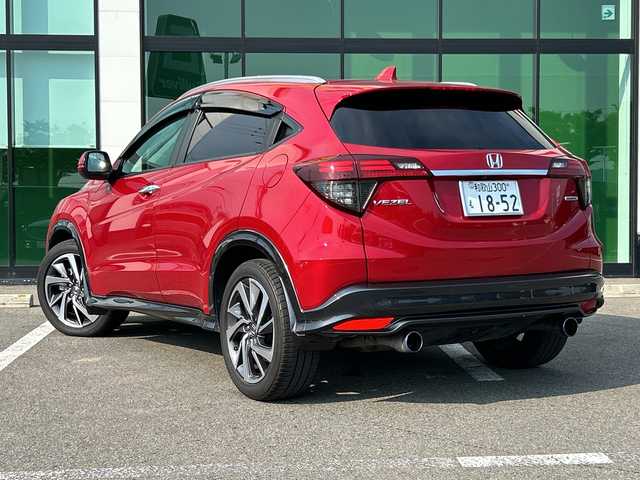 ホンダ ヴェゼル ツーリング・ホンダセンシング 和歌山県 2019(令1)年 5.7万km プレミアムクリスタルレッドM 社外ナビ/フルセグTV/（AM/FM/CD/DVD/Bluetooth/USB）/衝突軽減ブレーキ/レーンキープ/横滑り防止/クルーズコントロール/パドルシフト/ETC/ドライブレコーダー/オートライト/フォグランプ/スマートキー/プッシュスタート/ハンドルスイッチ/純正フロアマット/純正AW/革巻ハンドル/社外マフラー