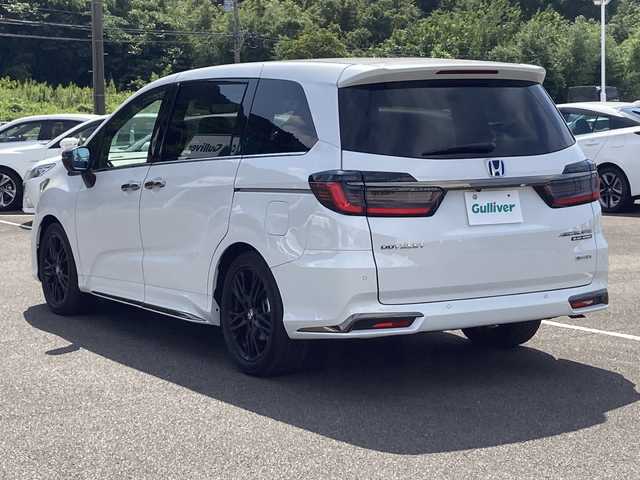 ホンダ オデッセイ ハイブリッド e:HEVアブソルート EXブラックED 佐賀県 2023(令5)年 1.2万km プラチナホワイトパール Gathers11.4インチナビ/Gathers15.6インチフリップダウンモニター/マルチビューモニター/両側パワースライドドア/衝突被害軽減ブレーキ/路線逸脱警報/コーナーセンサー/ブラインドスポットインフォメーション/アダプティブクルーズコントロール/電動パーキングブレーキ/オートブレーキホールド/レザーシート/パワーシート/シートヒーター/オットマン/パワーバックドア/ETC/置くだけ充電/ステアリングリモコン/プッシュスタート/スマートキー/LEDヘッドライト/フォグライト/純正ブラックアルミホイール