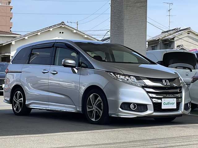 ホンダ オデッセイ アブソルートXホンダセンシングアドバンP 愛媛県 2016(平28)年 5.8万km スーパープラチナメタリック 登録時走行距離57869km/ワンオーナー /メーカーオプションナビ/両側パワースライドドア/全方位カメラ/ビルトインETC/ホンダセンシング /・衝突軽減ブレーキ/・横滑り防止装置/・レーンキープアシスト/・レーダークルーズコントロール/D席パワーシート/パドルシフト/3列シート/ハーフレザーシート/スペアキー/スマートキー/プッシュスタート /保証書