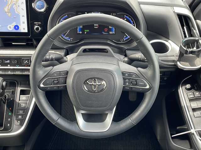 トヨタ ノア ハイブリッド S－Z 三重県 2022(令4)年 2.4万km アティチュードブラックマイカ 純正10.5型ナビ/両側パワースライドドア/HDMI/AC100V電源/追従走行/衝突軽減ブレーキ/BSM/渋滞時支援/電子パーキング/純正ビルトインETC2.0/ブルーミラー/後席USB給電/純正TV＋CD・DVDデッキ/電動格納ミラー/禁煙車