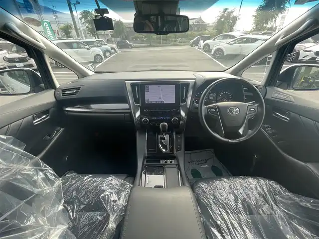 トヨタ アルファード S Cパッケージ 愛媛県 2021(令3)年 2.9万km ホワイトパールクリスタルシャイン サンルーフ/プリクラッシュセーフティ/レーントレーシングアシスト/パーキングサポートブレーキ/ロードサインアシスト/クリアランスソナー /レーダークルーズコントロール/純正デイスプレイオーディオ/　CD/DVD/Bluetooth/ワンセグTV/TVキャンセラー付き/バックカメカメラ/前後ドライブレコーダー/ ビルトインETC/両側パワースライドドア/黒革シート/前席パワーシート/前席シートヒーター/シートベンチレーション/オートライト/三眼LEDヘッドライト/ステアリングヒーター/純正18インチAW/プッシュスタート/フロアマット