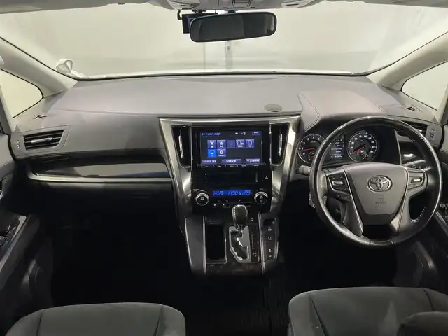 トヨタ ヴェルファイア Z 愛知県 2015(平27)年 6.2万km ホワイトパールクリスタルシャイン 純正９インチナビ　/（Bluetooth/フルセグTV/SD/CD・DVD再生/AM/FM)/１１インチフリップダウンモニター　/両側パワースライドドア　/ＡＣ１００Ｖ　/ビルトインＥＴＣ　/バックカメラ　　/ドライブレコーダー　/クリアランスソナー　/ＬＥＤヘッドライト/LEDフォグランプ/オットマン/プッシュスタート/　　-スマートキー/横滑り防止/アクセサリーソケット