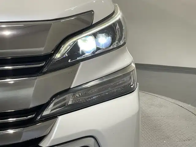 トヨタ ヴェルファイア Z 愛知県 2015(平27)年 6.2万km ホワイトパールクリスタルシャイン 純正９インチナビ　/（Bluetooth/フルセグTV/SD/CD・DVD再生/AM/FM)/１１インチフリップダウンモニター　/両側パワースライドドア　/ＡＣ１００Ｖ　/ビルトインＥＴＣ　/バックカメラ　　/ドライブレコーダー　/クリアランスソナー　/ＬＥＤヘッドライト/LEDフォグランプ/オットマン/プッシュスタート/　　-スマートキー/横滑り防止/アクセサリーソケット