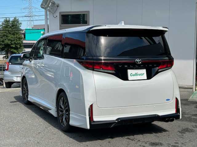 トヨタ ヴェルファイア Z プレミア 宮城県 2024(令6)年 1.4万km プラチナホワイトパールマイカ ワンオーナー/純正エアロ/サンルーフ/4WD/ユニバーサルステップ/ヘッドアップディスプレイ/純正メモリナビ/FM/AM/BT/USB/フルセグTV/フリップダウンモニター/アラウンドビューモニター/レザーシート/全席パワーシート/全席シートクーラー/全席シートヒーター/セカンドシートオットマン/パワーバックドア/ステアリングスイッチ/ステアリングヒーター/両側パワースライドドア/デジタルインナーミラー/ブラインドスポットモニター/純正アルミ夏タイヤ19インチ/純正フロアマット/パーキングアシスト/追従型クルーズコントロール/レーンキープアシスト/アイドリングストップ/衝突被害軽減システム/パドルシフト/コーナーセンサー/LEDライト/ETC2.0/前後ドライブレコーダー/プッシュスタート