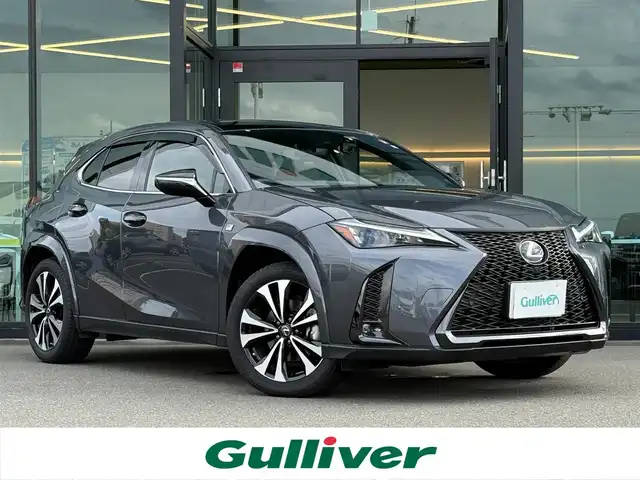 レクサス ＵＸ 250h Fスポーツ エモーショナルエクスプローラ 東京都 2023(令5)年 0.9万km ベージュM/ウォームグレーM ワンオーナー/純正ナビ　/（フルセグTV/FM/AM/Bluetooth/Miracast/USB)/ドライブレコーダー/ブラインドスポットモニター/プリクラッシュセーフティ/ETC2.0/レザーシート/レーダークルーズコントロール/革巻きステアリング/ステアリングスイッチ/パドルシフト/スマートキー/プッシュスタート/ステアリングヒーター/シートヒーター/エアシート/車線逸脱/横滑り防止装置/トノカバー/フロント・リアコーナーセンサー/トノカバー/ISOFIX/電動格納ウインカーミラー/リアプライバシーガラス/新車時保証書/記録簿/取扱説明書