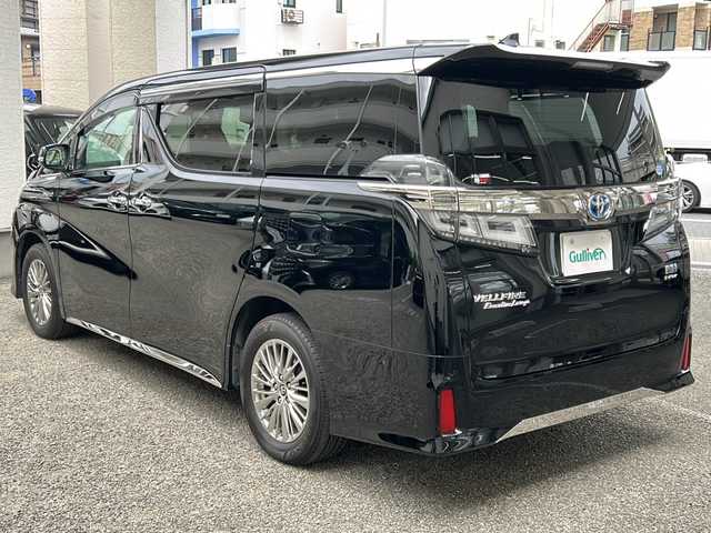 トヨタ ヴェルファイア ハイブリット ZR Gエディション 兵庫県 2018(平30)年 6.3万km ブラック 純正SDメーカーナビ/　Bluetooth/AM/FM/CD/DVD/純正ビルトインETC/両側パワースライド/２列目エグゼクティブパワーシート/パワーリクライニング・快適温熱シート/パワーオットマン/後席モニター/三列シート/パワーバックドア/４WD/１００V充電/シートヒーター（D+N席）/エアシート（D+N席）/パワーシート（D+N席）/オットマン/フルセグTV（走行中視聴可）/MTモード付AT/電動リアゲート/アダプティブクルーズコントロール/アンチロック・ブレーキ・システム/横滑り防止装置/アイドリングストップ/盗難防止装置/衝突軽減システム/レーンキープアシスト/前後コーナーセンサー/パワーステアリング/パワーウィンドウ/エアバッグ（W+サイド）/カーテンエアバッグ/オートマチックハイビーム/純正アルミホイール/純正フロアマット/スペアキー（１本）/保証書/取扱説明書