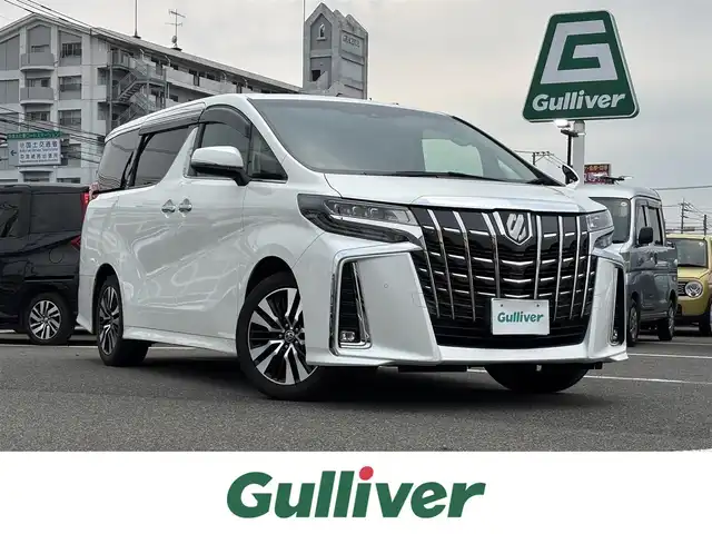 トヨタ アルファード S Cパッケージ 大分県 2021(令3)年 7万km ホワイトパールクリスタルシャイン ・純正ナビ(USB.BT)/・フルセグテレビ/・バックモニター/・AC100V/・両側パワースライドドア/・プリクラッシュセーフティ/・ブラインドスポットモニター/・コーナーセンサー/・ドライブレコーダー/・ETC/・ハンドルヒーター/・ステアリングリモコン/・オートハイビーム/・レザーシート/・パワーシート/・シートメモリー/・シートヒーター/・シートクーラー