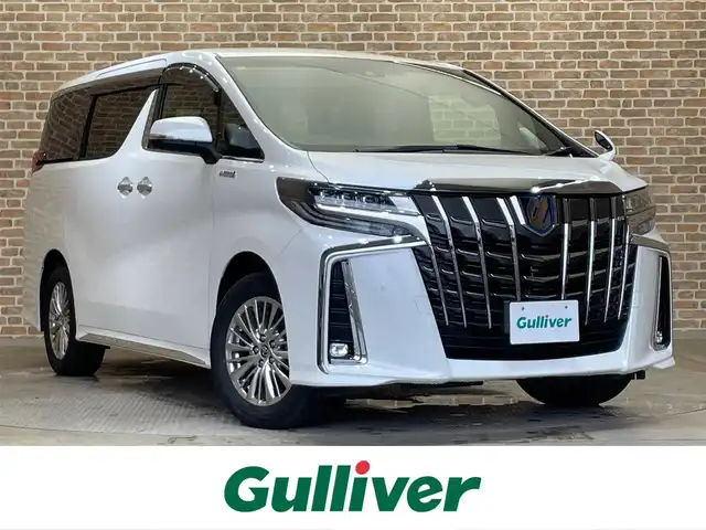 トヨタ アルファードハイブリット S タイプゴールド 岩手県 2021(令3)年 5万km ホワイトパールクリスタルシャイン ４WD/両側パワースライドドア/パワーバックドア/三眼LEDヘッドランプ/トヨタセーフティセンス/プリクラッシュセーフティ/レーダークルーズコントロール/レーントレーシングアシスト/アダプティブハイビームシステム/ロードサインアシスト/クリアランスソナー/パーキングサポートブレーキ/横滑り防止装置/AC100V100Wアクセサリーコンセント/オットマン/ウォークスルー/純正ナビ/ステアリングスイッチ/ETC2.0/ドライブレコーダー/純正17インチアルミホイール