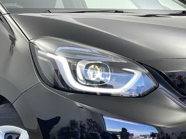 ホンダ フィット ホーム 新潟県 2021(令3)年 2.3万km クリスタルブラックパール ワンオーナー/純正ディーラーＯＰナビ/バックカメラ/フルセグＴＶ/前後ドライブレコーダー/ホンダセンシング/プッシュスタート/コーナーセンサー/オートライト/ＬＥＤヘッドライト/アイドリングストップ/オートブレーキホールド/ステアリングスイッチ/15インチスタッドレスＡＷ積込み