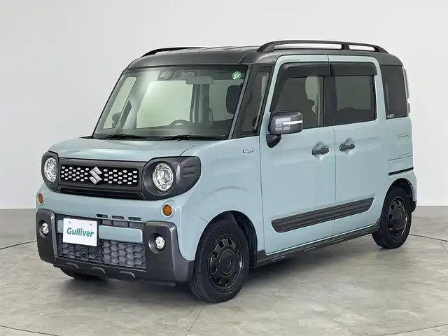 スズキ スペーシア ギア HYBRID XZ 愛知県 2020(令2)年 1.3万km オフブルーメタリック/ガンメタリック2トーンルーフ スズキセーフティサポート/　　・デュアルセンサーブレーキサポート/　　・後退時ブレーキサポート/　　・誤発進抑制機能/　　・車線逸脱抑制機能/　　・標識認識機能/ケンウッド製7インチナビ/　　CD/DVD/BT/フルセグ/バックカメラ/ステアリングリモコン/シートヒーター（前席）/両側パワースライドドア/ルーフレール/純正ホイールキャップ/純正LEDヘッドライト/フォグランプ/盗難防止機能