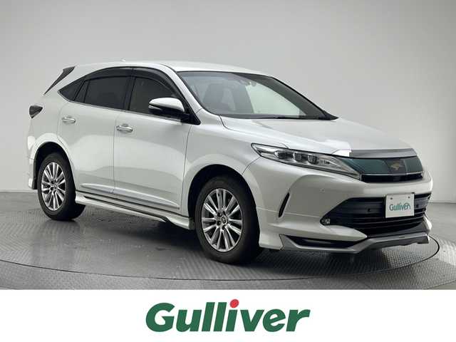 トヨタ ハリアー プレミアム メタル&レザーP 兵庫県 2018(平30)年 7.1万km ホワイトパールクリスタルシャイン アルパイン１０型メモリナビ（EX10Z）/（CD、DVD、SD、BT、フルセグ）/ドライブレコーダー/バックカメラ/コーナーセンサー/アイドリングストップ/レザーシート/パワーシート/シートヒーター/ベンチレーション/パワーバックドア/ACC/LDA/PCS/ビルトインETC/MODELLISTA（F.S.R）スポイラー/オートハイビーム/純正フロアマット/純正バイザー/純正１８インチAW
