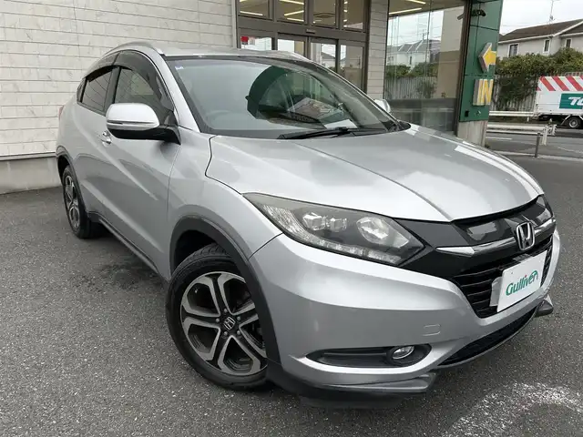ホンダ ヴェゼル S 埼玉県 2014(平26)年 10.7万km アラバスターシルバーメタリック 登録時106317km/純正ナビ（TV/BT/AM/FM）/バックカメラ/クルーズコントロール追従無/パドルシフト/ハーフレザー/シートヒーター（D席＋N席）/ＥＴＣ/純正１7インチアルミホイールト/純正フロアマット/ドアバイザー/フロントフォグランプ/電動格納ミラー/横滑り防止装置/アイドリングストップ/ステアリングスイッチ/Pスタート/スマートキー/スペアキー1本/保証書/ナビ/車両取扱説明書