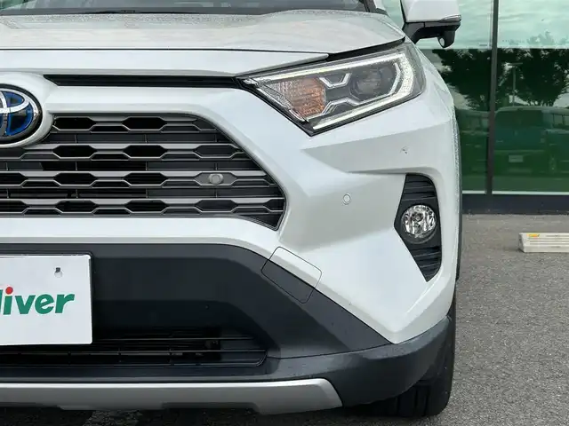 トヨタ ＲＡＶ４ ハイブリットG 和歌山県 2019(令1)年 13.1万km ホワイトパールクリスタルシャイン 純正9インチナビ/フルセグTV/(AM/FM/CD/Bluetooth)/バックカメラ/衝突軽減ブレーキ/横滑り防止機能/レーダークルコン/ブラインドスポットモニター/シートヒーター/ステアリングヒーター/パワーシート/ビルトインETC/前後ドラレコ/デジタルインナーミラー/ステアリングリモコン/シートメモリー/電動パーキング/オートホールド/LEDヘッドライト/フォグランプ