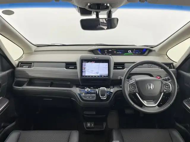 ホンダ フリード ハイブリット G ホンダセンシング 富山県 2020(令2)年 6.4万km クリスタルブラックパール 純正9型ナビ（AM/FM/DVD/BT/USB/フルセグ）/バックカメラ/ドライブレコーダー/ETC/ハーフレザーシート/シートヒーター/衝突被害軽減システム/レーダークルーズコントロール/レーンキープアシスト/横滑り防止装置/アイドリングストップ/純正フロアマット/オートLEDライト/革巻きステアリング/ステアリングスイッチ/スマートキー/スペアキー