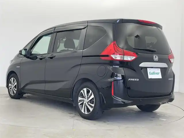 ホンダ フリード ハイブリット G ホンダセンシング 富山県 2020(令2)年 6.4万km クリスタルブラックパール 純正9型ナビ（AM/FM/DVD/BT/USB/フルセグ）/バックカメラ/ドライブレコーダー/ETC/ハーフレザーシート/シートヒーター/衝突被害軽減システム/レーダークルーズコントロール/レーンキープアシスト/横滑り防止装置/アイドリングストップ/純正フロアマット/オートLEDライト/革巻きステアリング/ステアリングスイッチ/スマートキー/スペアキー