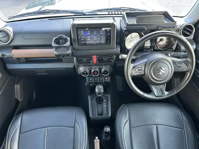 スズキ ジムニー シエラ JC 岡山県 2019(令1)年 6万km ジャングルグリーン 登録時走行距離59289km/ワンオーナー/社外ナビ/フルセグTV(AM.FM.CD.DVD.TV.BT)/バックカメラ/ETC/D/N席シートヒーター/衝突軽減ブレーキ/レーダークルーズコントロール/レーンキープアシスト/ダウンヒルアシストコントロール/横滑り防止装置/USB入力端子/オートライト/15インチ純正AW/オープンカントリーATタイヤ/純正フロアマット/純正OPフロントグリル/ルーフキャリア