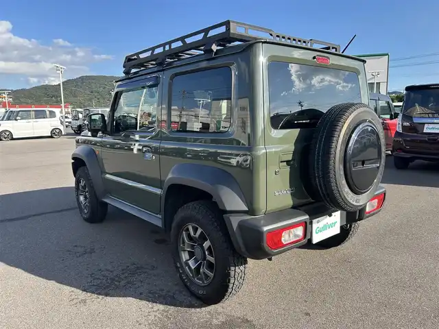 スズキ ジムニー シエラ JC 岡山県 2019(令1)年 6万km ジャングルグリーン 登録時走行距離59289km/ワンオーナー/社外ナビ/フルセグTV(AM.FM.CD.DVD.TV.BT)/バックカメラ/ETC/D/N席シートヒーター/衝突軽減ブレーキ/レーダークルーズコントロール/レーンキープアシスト/ダウンヒルアシストコントロール/横滑り防止装置/USB入力端子/オートライト/15インチ純正AW/オープンカントリーATタイヤ/純正フロアマット/純正OPフロントグリル/ルーフキャリア