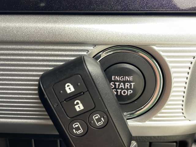 スズキ スペーシア カスタム HYBRID XS 秋田県 2024(令6)年 1.6万km ピュアホワイトパール/ブラック2トーン 4WD/社外メモリナビ　/Bluetooth/AM/FM/両側パワースライドドア　/バックカメラ　/衝突被害軽減システム　/レーダークルーズコントロール　/レーンキープアシスト　/横滑り防止装置　/LEDヘッドライト/フォグランプ/前席シートヒーター/前方ドライブレコーダー/ETC/スペアキー/純正アルミホイール/社外フロアマット/ミラーヒーター/ウィンカーミラー/ステアリングスイッチ