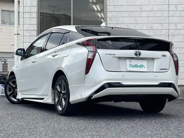 トヨタ プリウス A プレミアム　ツーリングセレ 福岡県 2016(平28)年 9.1万km ホワイトパールクリスタルシャイン モデリスタエアロ(フロント/サイド/リヤ)/純正9インチメモリナビ【DSZT-YC4T】/　(AM/FM/CD/DVD/Bluetooth/フルセグTV)/バックカメラ/トヨタセーフティセンス/・プリクラッシュセーフティ/・レーダークルーズコントロール/・レーンディパーチャーアラート/・オートマッチックハイビーム/ブラインドスポットモニター/シンプルインテリジェントパーキングアシスト/ヘッドアップディスプレイ/横滑り防止/ドライブモードセレクト/純正ビルトインETC/黒レザーシート/革巻きステアリング/ステアリングスイッチ/パワーシート(D)/シートヒーター(D/N)/純正フロアマット/ナノイー/100V電源/ISOFIX/スペアキー×1/保証書/取扱説明書/ナビ取扱説明書