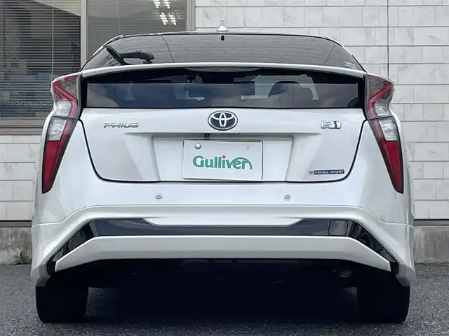 トヨタ プリウス A プレミアム　ツーリングセレ 福岡県 2016(平28)年 9.1万km ホワイトパールクリスタルシャイン モデリスタエアロ(フロント/サイド/リヤ)/純正9インチメモリナビ【DSZT-YC4T】/　(AM/FM/CD/DVD/Bluetooth/フルセグTV)/バックカメラ/トヨタセーフティセンス/・プリクラッシュセーフティ/・レーダークルーズコントロール/・レーンディパーチャーアラート/・オートマッチックハイビーム/ブラインドスポットモニター/シンプルインテリジェントパーキングアシスト/ヘッドアップディスプレイ/横滑り防止/ドライブモードセレクト/純正ビルトインETC/黒レザーシート/革巻きステアリング/ステアリングスイッチ/パワーシート(D)/シートヒーター(D/N)/純正フロアマット/ナノイー/100V電源/ISOFIX/スペアキー×1/保証書/取扱説明書/ナビ取扱説明書