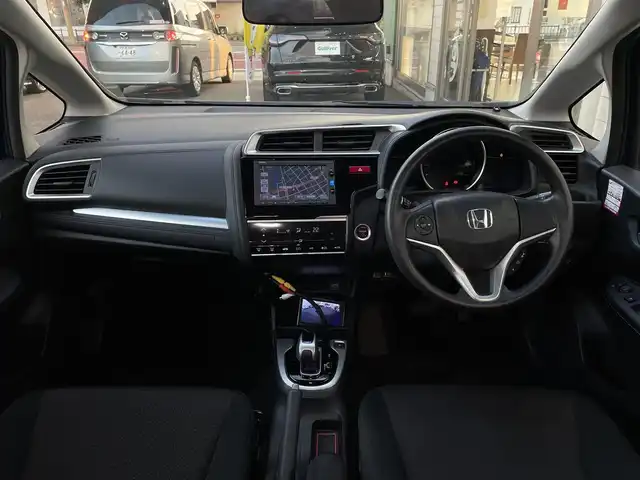 ホンダ フィット ハイブリット Fパッケージ 大分県 2016(平28)年 10.9万km ブリリアントスポーティブルーメタリック2トーン 〇純正メモリーナビ（VXM-164CSi）/　CD/DVD/BT/ワンセグ/ラジオ/〇バックカメラ/〇社外サイドカメラ/〇ETC/〇スマートキー/〇エンジンプッシュスタート/〇ステアリングスイッチ/〇ウインカーミラー/〇フロアマット/〇ドアバイザー/〇プライバシーガラス/〇ヘッドライトレベライザー/〇取扱説明書/〇スペアキー