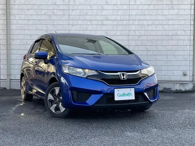 ホンダ フィット ハイブリット Fパッケージ 大分県 2016(平28)年 10.9万km ブリリアントスポーティブルーメタリック2トーン 〇純正メモリーナビ（VXM-164CSi）/　CD/DVD/BT/ワンセグ/ラジオ/〇バックカメラ/〇社外サイドカメラ/〇ETC/〇スマートキー/〇エンジンプッシュスタート/〇ステアリングスイッチ/〇ウインカーミラー/〇フロアマット/〇ドアバイザー/〇プライバシーガラス/〇ヘッドライトレベライザー/〇取扱説明書/〇スペアキー