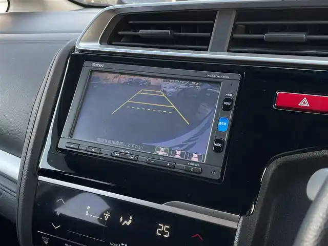 ホンダ フィット ハイブリット Fパッケージ 大分県 2016(平28)年 10.9万km ブリリアントスポーティブルーメタリック2トーン 〇純正メモリーナビ（VXM-164CSi）/　CD/DVD/BT/ワンセグ/ラジオ/〇バックカメラ/〇社外サイドカメラ/〇ETC/〇スマートキー/〇エンジンプッシュスタート/〇ステアリングスイッチ/〇ウインカーミラー/〇フロアマット/〇ドアバイザー/〇プライバシーガラス/〇ヘッドライトレベライザー/〇取扱説明書/〇スペアキー