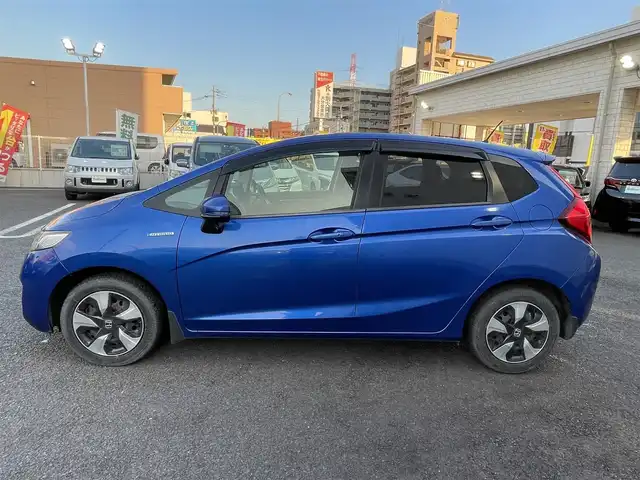 ホンダ フィット ハイブリット Fパッケージ 大分県 2016(平28)年 10.9万km ブリリアントスポーティブルーメタリック2トーン 〇純正メモリーナビ（VXM-164CSi）/　CD/DVD/BT/ワンセグ/ラジオ/〇バックカメラ/〇社外サイドカメラ/〇ETC/〇スマートキー/〇エンジンプッシュスタート/〇ステアリングスイッチ/〇ウインカーミラー/〇フロアマット/〇ドアバイザー/〇プライバシーガラス/〇ヘッドライトレベライザー/〇取扱説明書/〇スペアキー