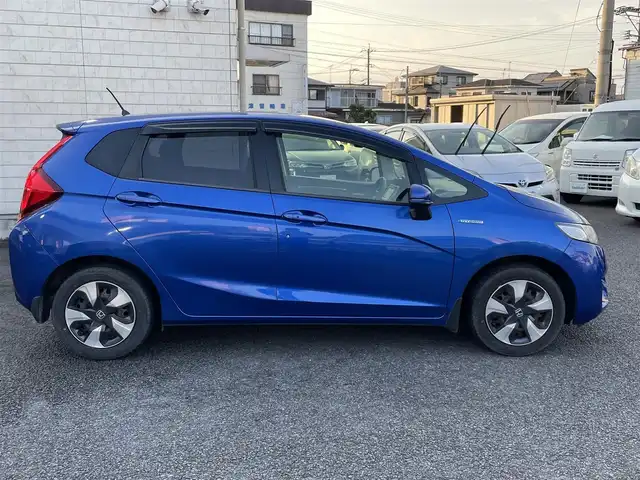 ホンダ フィット ハイブリット Fパッケージ 大分県 2016(平28)年 10.9万km ブリリアントスポーティブルーメタリック2トーン 〇純正メモリーナビ（VXM-164CSi）/　CD/DVD/BT/ワンセグ/ラジオ/〇バックカメラ/〇社外サイドカメラ/〇ETC/〇スマートキー/〇エンジンプッシュスタート/〇ステアリングスイッチ/〇ウインカーミラー/〇フロアマット/〇ドアバイザー/〇プライバシーガラス/〇ヘッドライトレベライザー/〇取扱説明書/〇スペアキー