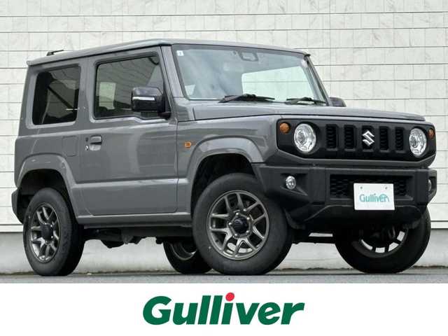 スズキ ジムニー XC 岩手県 2024(令6)年 2.2万km ミディアムグレー 禁煙車/4WD（切替）/前席シートヒーター/社外ナビ/→フルセグTV/Bluetooth/CD/FM/AM/バックドア/ステアリングスイッチ/横滑り防止装置/クルーズコントロール/リアコーナーセンサー/レーンキープアシスト/衝突軽減システム/ダウンヒルアシストコントロール/オートライト/LEDヘッドライト/フォグライト/〇プッシュスタート/〇電動格納ミラー/〇ウィンカーミラー/〇フロアマット/〇シガーソケット/〇スマートキー/スペアキー/前方ドライブレコーダー/ETC