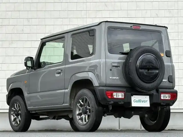 スズキ ジムニー XC 岩手県 2024(令6)年 2.2万km ミディアムグレー 禁煙車/4WD（切替）/前席シートヒーター/社外ナビ/→フルセグTV/Bluetooth/CD/FM/AM/バックドア/ステアリングスイッチ/横滑り防止装置/クルーズコントロール/リアコーナーセンサー/レーンキープアシスト/衝突軽減システム/ダウンヒルアシストコントロール/オートライト/LEDヘッドライト/フォグライト/〇プッシュスタート/〇電動格納ミラー/〇ウィンカーミラー/〇フロアマット/〇シガーソケット/〇スマートキー/スペアキー/前方ドライブレコーダー/ETC