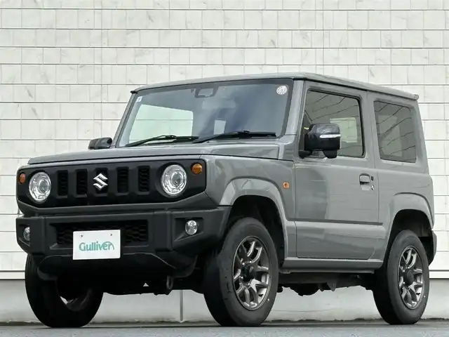 スズキ ジムニー XC 岩手県 2024(令6)年 2.2万km ミディアムグレー 禁煙車/4WD（切替）/前席シートヒーター/社外ナビ/→フルセグTV/Bluetooth/CD/FM/AM/バックドア/ステアリングスイッチ/横滑り防止装置/クルーズコントロール/リアコーナーセンサー/レーンキープアシスト/衝突軽減システム/ダウンヒルアシストコントロール/オートライト/LEDヘッドライト/フォグライト/〇プッシュスタート/〇電動格納ミラー/〇ウィンカーミラー/〇フロアマット/〇シガーソケット/〇スマートキー/スペアキー/前方ドライブレコーダー/ETC