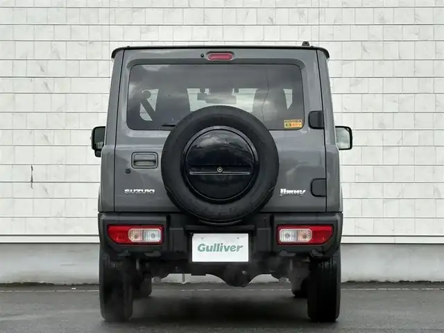 スズキ ジムニー XC 岩手県 2024(令6)年 2.2万km ミディアムグレー 禁煙車/4WD（切替）/前席シートヒーター/社外ナビ/→フルセグTV/Bluetooth/CD/FM/AM/バックドア/ステアリングスイッチ/横滑り防止装置/クルーズコントロール/リアコーナーセンサー/レーンキープアシスト/衝突軽減システム/ダウンヒルアシストコントロール/オートライト/LEDヘッドライト/フォグライト/〇プッシュスタート/〇電動格納ミラー/〇ウィンカーミラー/〇フロアマット/〇シガーソケット/〇スマートキー/スペアキー/前方ドライブレコーダー/ETC