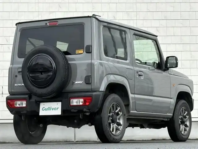 スズキ ジムニー XC 岩手県 2024(令6)年 2.2万km ミディアムグレー 禁煙車/4WD（切替）/前席シートヒーター/社外ナビ/→フルセグTV/Bluetooth/CD/FM/AM/バックドア/ステアリングスイッチ/横滑り防止装置/クルーズコントロール/リアコーナーセンサー/レーンキープアシスト/衝突軽減システム/ダウンヒルアシストコントロール/オートライト/LEDヘッドライト/フォグライト/〇プッシュスタート/〇電動格納ミラー/〇ウィンカーミラー/〇フロアマット/〇シガーソケット/〇スマートキー/スペアキー/前方ドライブレコーダー/ETC