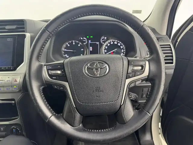 トヨタ ランドクルーザー プラド TX Lパッケージ 愛知県 2019(平31)年 7.2万km ホワイトパールクリスタルシャイン ワンオーナー/4WD/トヨタセーフティセンス/　　・プリクラッシュセーフティ/　　・レーンディバーチャーアラート/　　・レーントレーシングアシスト/　　・レーダークルーズコントロール/　　・オートマチックハイビーム/　　・ロードサインアシスト/　　・クリアランスソナー/TRDエアロセット/　　・フロントスポイラー/　　・リヤバンパースポイラー/アルパイン製9インチナビ/フルセグTV/バックカメラ/レザーシート/シートヒーター（前席）/エアシート（前席）/電動格納サードシート/LEDルームランプ/クリアランスソナー/取扱説明書/保証書