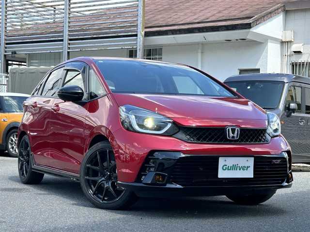 ホンダ フィット e:HEV RS 奈良県 2024(令6)年 0.9万km プレミアムクリスタルレッドM 純正エアロ/ハーフレザー/社外AW（純正積込）/追従式クルコン/Bluetooth/ETC2.0/フルセグTV/ブレーキホールド/パドルシフト/バックカメラ/パドルシフト/スマートキー/UAB付/純正スタートスイッチカバー/プッシュスタート/取扱説明書